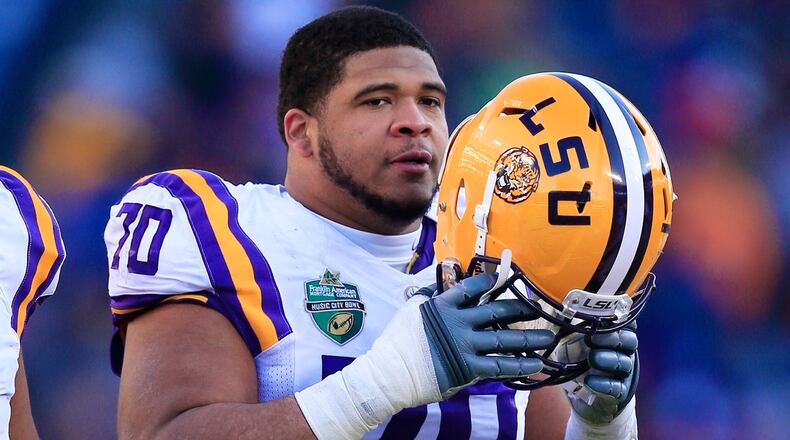 LSU offensive tackle La'el Collins (70) plays against Notre Dame in the first half of the Music City Bowl NCAA college football game Tuesday, Dec. 30, 2014, in Nashville, Tenn. He signed with the Cowboys after getting bypassed in the NFL draft because he was linked to a murder investigation. (AP Photo/Mark Humphrey)