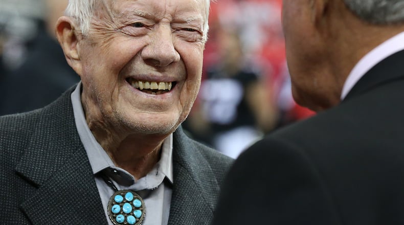 October 23, 2016 Atlanta: Jimmy Carter shares a laugh with Falcons owner Arthur Blank before playing the Chargers in an NFL football game on Sunday, Oct. 23, 2016, in Atlanta. Carter was on hand for the coin toss, just one more instance of the former president and Georgia governor packed schedule of undertakings and newsmaking in 2016. Curtis Compton /ccompton@ajc.com