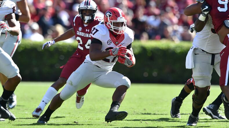 Running back Nick Chubb, in his first full game back from an injury, rushed for both of Georgia’s touchdowns in the first half against South Carolina Sunday. The game was rescheduled from Saturday because of Hurricane Matthew. (Brant Sanderlin / bsanderlin@ajc.com)