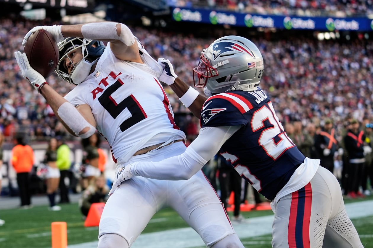 Falcons wide receiver Drake London (left) makes a touchdown catch against Patriots cornerback Marcus Jones on Sunday, Nov. 2, 2025, in Foxborough, Mass. London had his third 100-yard game of the season versus the Patriots. (Robert F. Bukaty/AP)