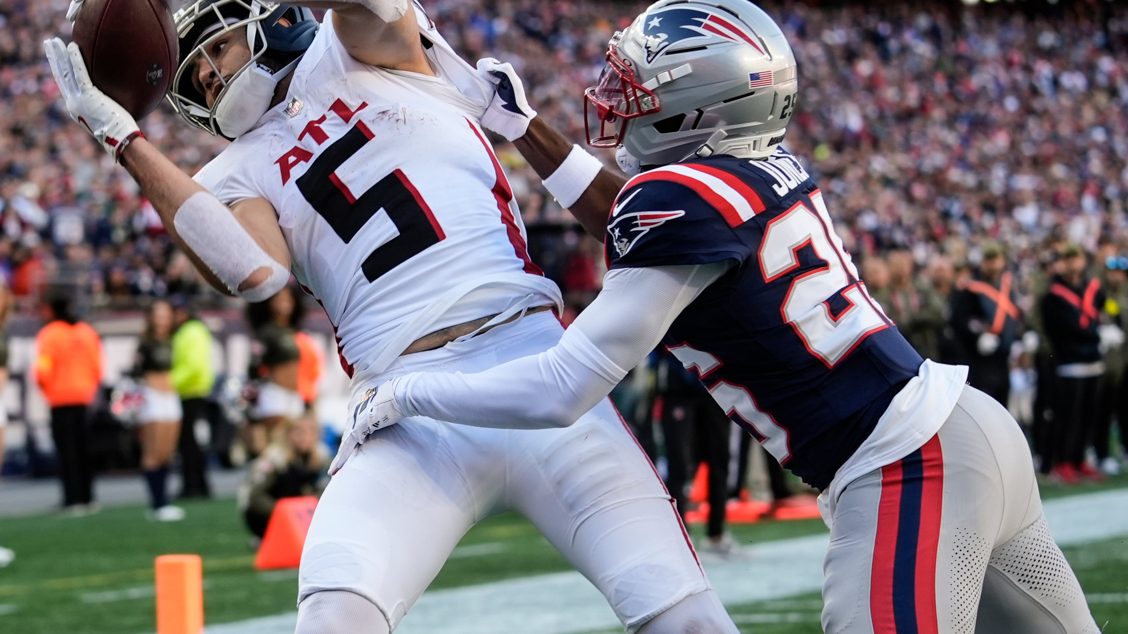 Falcons wide receiver Drake London (left) makes a touchdown catch against Patriots cornerback Marcus Jones on Sunday, Nov. 2, 2025, in Foxborough, Mass. London had his third 100-yard game of the season versus the Patriots. (Robert F. Bukaty/AP)