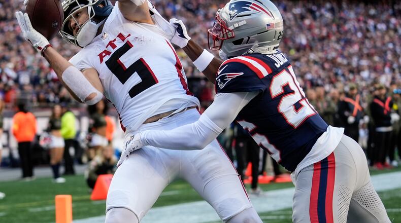 Falcons wide receiver Drake London (left) makes a touchdown catch against Patriots cornerback Marcus Jones on Sunday, Nov. 2, 2025, in Foxborough, Mass. London had his third 100-yard game of the season versus the Patriots. (Robert F. Bukaty/AP)