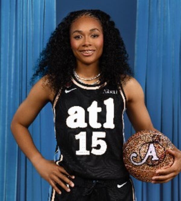 Allisha Gray models the new Atlanta Dream jerseys.