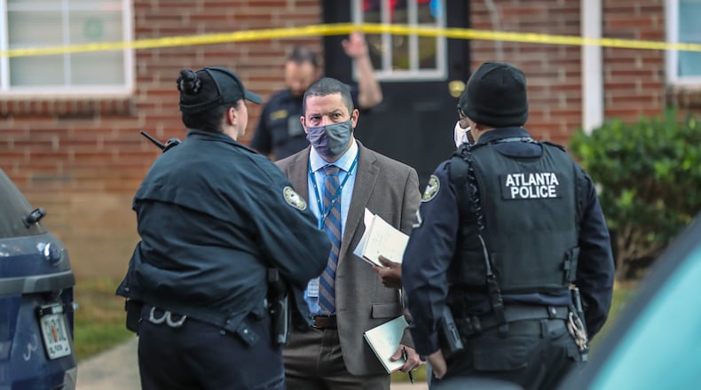 October 20, 2020 Atlanta: Atlanta police officers investigate the scene at the Pavilion Place Apartments in the 500 block of Cleveland Avenue about 5:45 a.m. A 59-year-old woman was shot multiple times inside an apartment in the 10 building, according to Malecki. She was taken to a hospital, where she died. (John Spink / John.Spink@ajc.com)