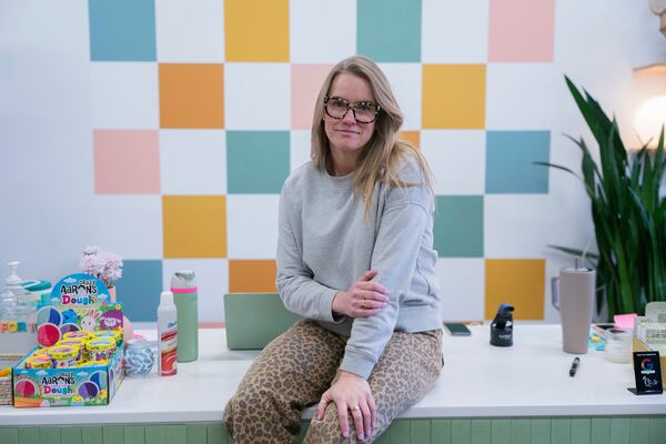 Elizabeth Mahon, owner of the baby store Three Littles, poses for a photo at her Union Market location in Washington, on Wednesday, April 16, 2025. (AP Photo/Nathan Howard)