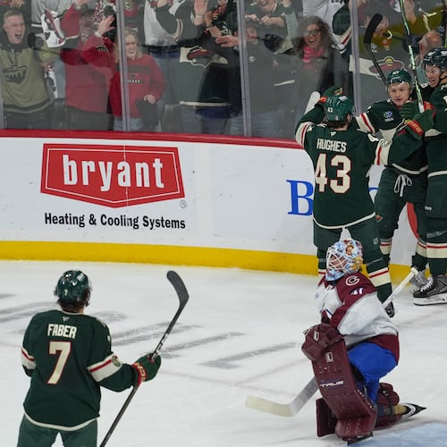 Minnesota Wild left wing Kirill Kaprizov (97) celebrates with teammates after scoring during the first period of Game 3 of an NHL Stanley Cup hockey second-round playoff series against the Colorado Avalanche, Saturday, May 9, 2026, in St. Paul, Minn. (AP Photo/Abbie Parr)