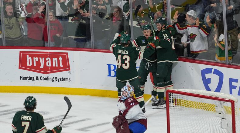Minnesota Wild left wing Kirill Kaprizov (97) celebrates with teammates after scoring during the first period of Game 3 of an NHL Stanley Cup hockey second-round playoff series against the Colorado Avalanche, Saturday, May 9, 2026, in St. Paul, Minn. (AP Photo/Abbie Parr)