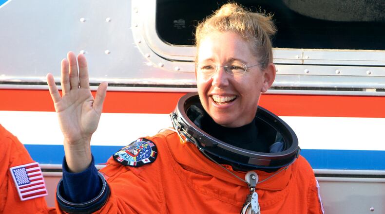 Space shuttle Atlantis, STS-135, astronaut and Georgia Tech grad Sandra Magnus waves Thursday, June 23, 2011 during a launch dress rehearsal at Kennedy Space Center in Florida.