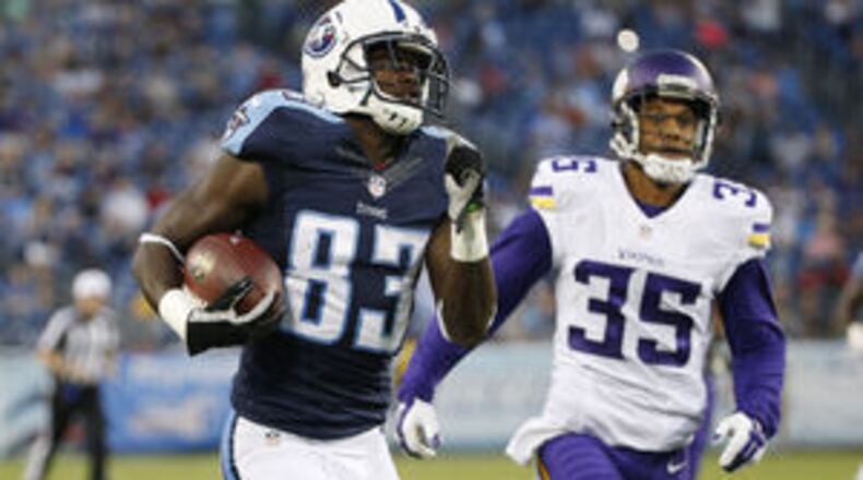 Tennessee Titans wide receiver Harry Douglas (83) beats Minnesota Vikings cornerback Marcus Sherels (35) to the end zone for a touchdown on a 59-yard pass play in the first half of a exhibition game at Nashville, Tenn. (Weston Kenney/The Associated Press)