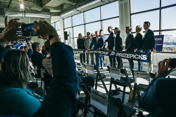 Governor Brian Kemp and speakers cut the ribbon at the PrizePicks office ribbon cutting in Atlanta, Georgia on Thursday, Dec. 12, 2024 (Olivia Bowdoin for the AJC).