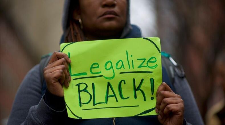 Protestor Nina Lyrispect Ball, 35, demonstrates outside a Starbucks on April 15, 2018 in Philadelphia, Pennsylvania. Police arrested two black men who were simply waiting inside a Center City Starbucks for a meeting, which prompted an apology from the company's CEO.