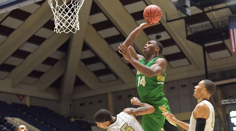 Buford's Marcus Watson (14) flies over Fayette County's Terrell Bradley during state championship tournament game at the Macon Centreplex Friday, March 8, 2019, in Macon. Buford won, 76-69.