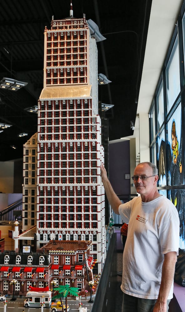 Father and son build giant Lego cityscape