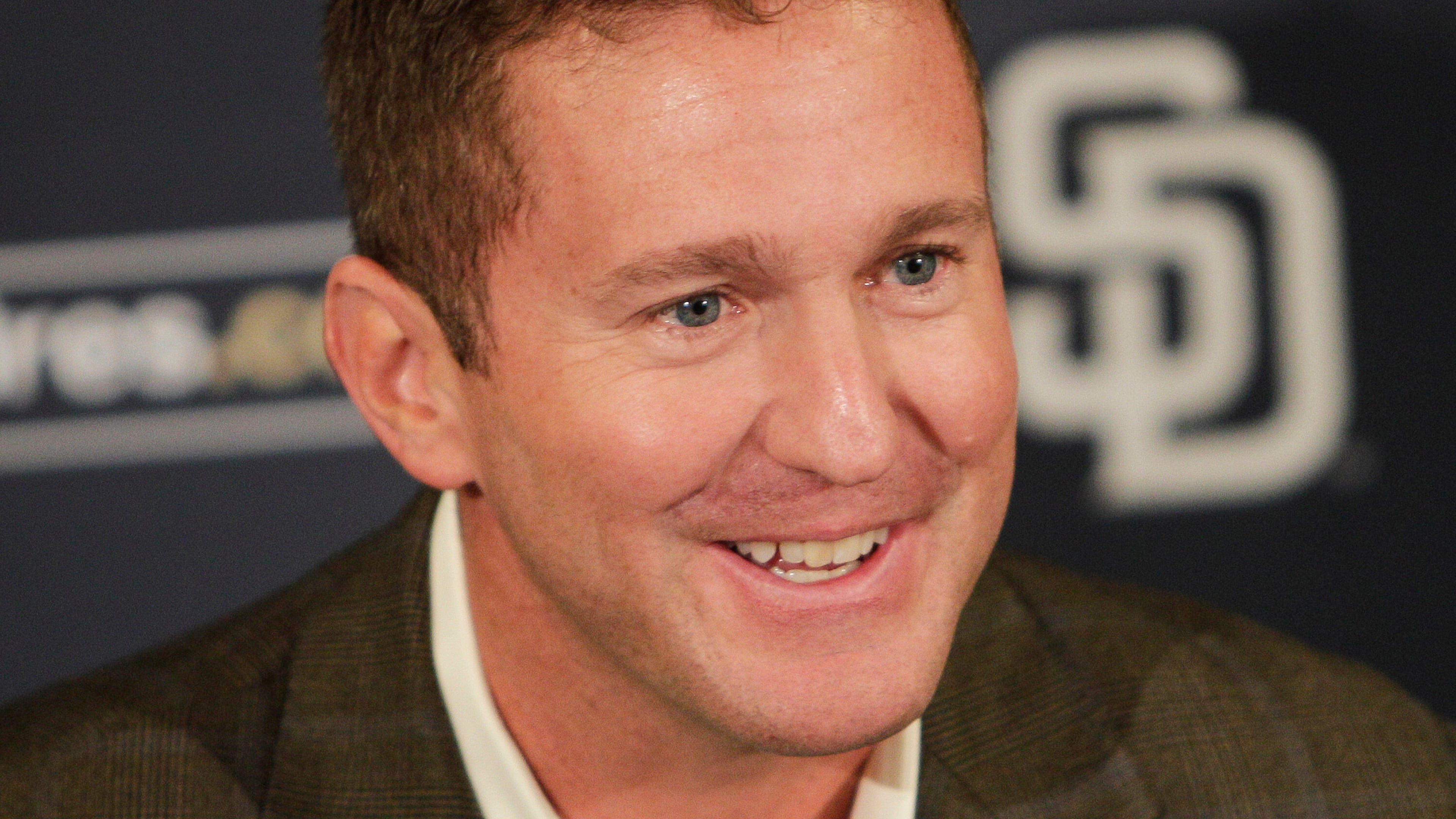 FILE - San Diego Padres general manager Josh Byrnes smiles during a baseball news conference Monday, Oct. 31, 2011 in San Diego. (AP Photo/Lenny Ignelzi)