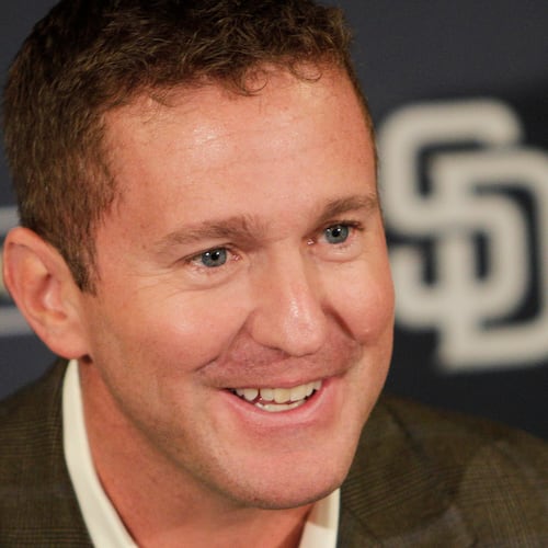 FILE - San Diego Padres general manager Josh Byrnes smiles during a baseball news conference Monday, Oct. 31, 2011 in San Diego. (AP Photo/Lenny Ignelzi)
