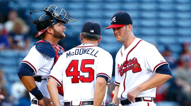 Roger McDowell has had to make several mound visits this season to calm his young starting pitchers such as Alex Wood. (Kevin C. Cox, Getty Images)