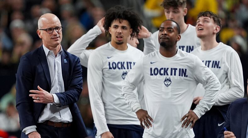 UConn head coach Dan Hurley, left, reacts during the second half of the NCAA college basketball tournament national championship game against Michigan at the Final Four, Monday, April 6, 2026, in Indianapolis. (AP Photo/Abbie Parr)