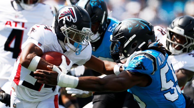 Atlanta Falcons wide receiver Ray-Ray McCloud is tackled by Carolina Panthers defensive tackle Cam Jackson during the first half of an NFL football game, Sunday, Sept. 21, 2025, in Charlotte, N.C. (AP Photo/Rusty Jones)