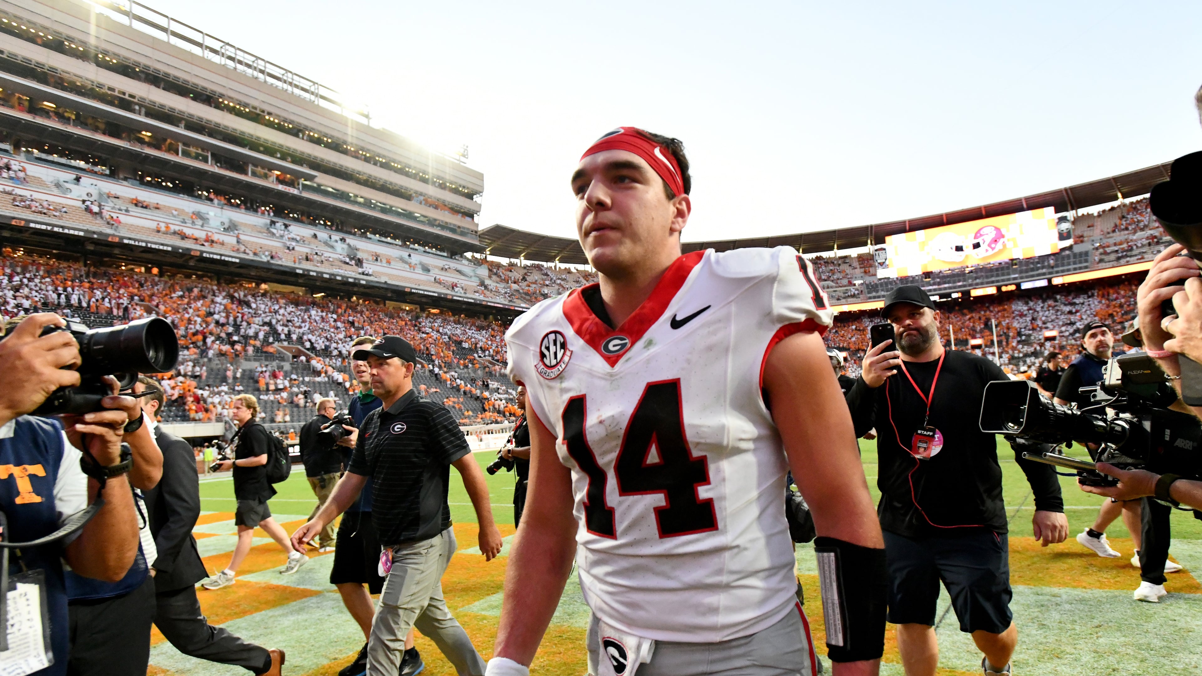 Georgia quarterback Gunner Stockton (14) leaves the football field after Georgia beat Tennessee during overtime in an NCAA football game at Neyland Stadium, Saturday, September 13, 2025, in Knoxville, Tenn. Georgia won 44-41 over Tennessee in overtime.