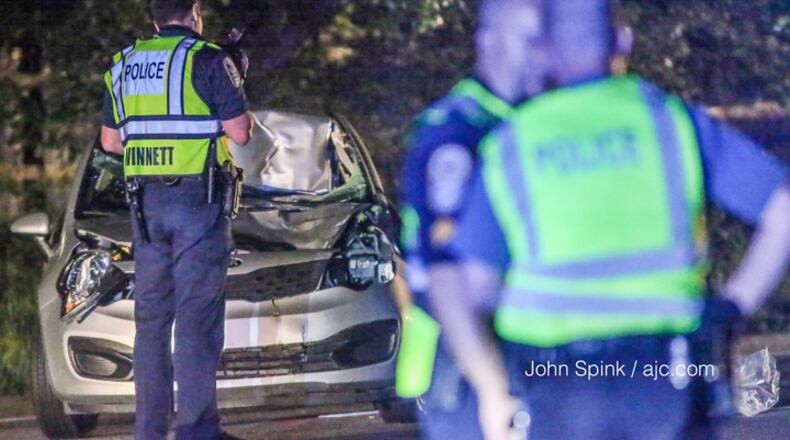 Jimmy Carter Boulevard is shut down while Gwinnett police investigate a deadly pedestrian accident. JOHN SPINK / JSPINK@AJC.COM