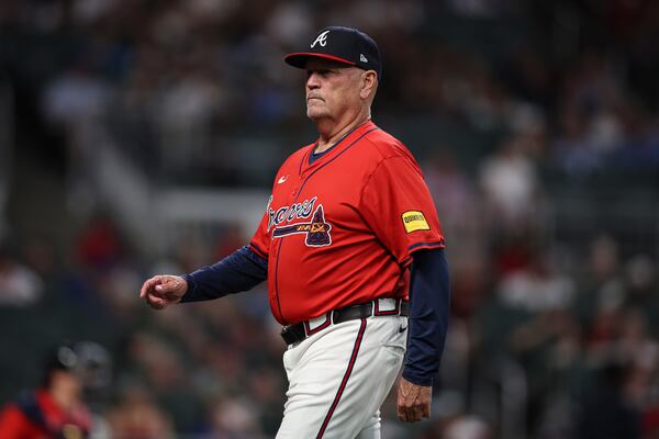 Atlanta Braves manager Brian Snitker (43) looks on after making a pitching change in the seventh inning of a baseball game against the Minnesota Twins, Friday, April 18, 2025, in Atlanta. (AP Photo/Colin Hubbard)