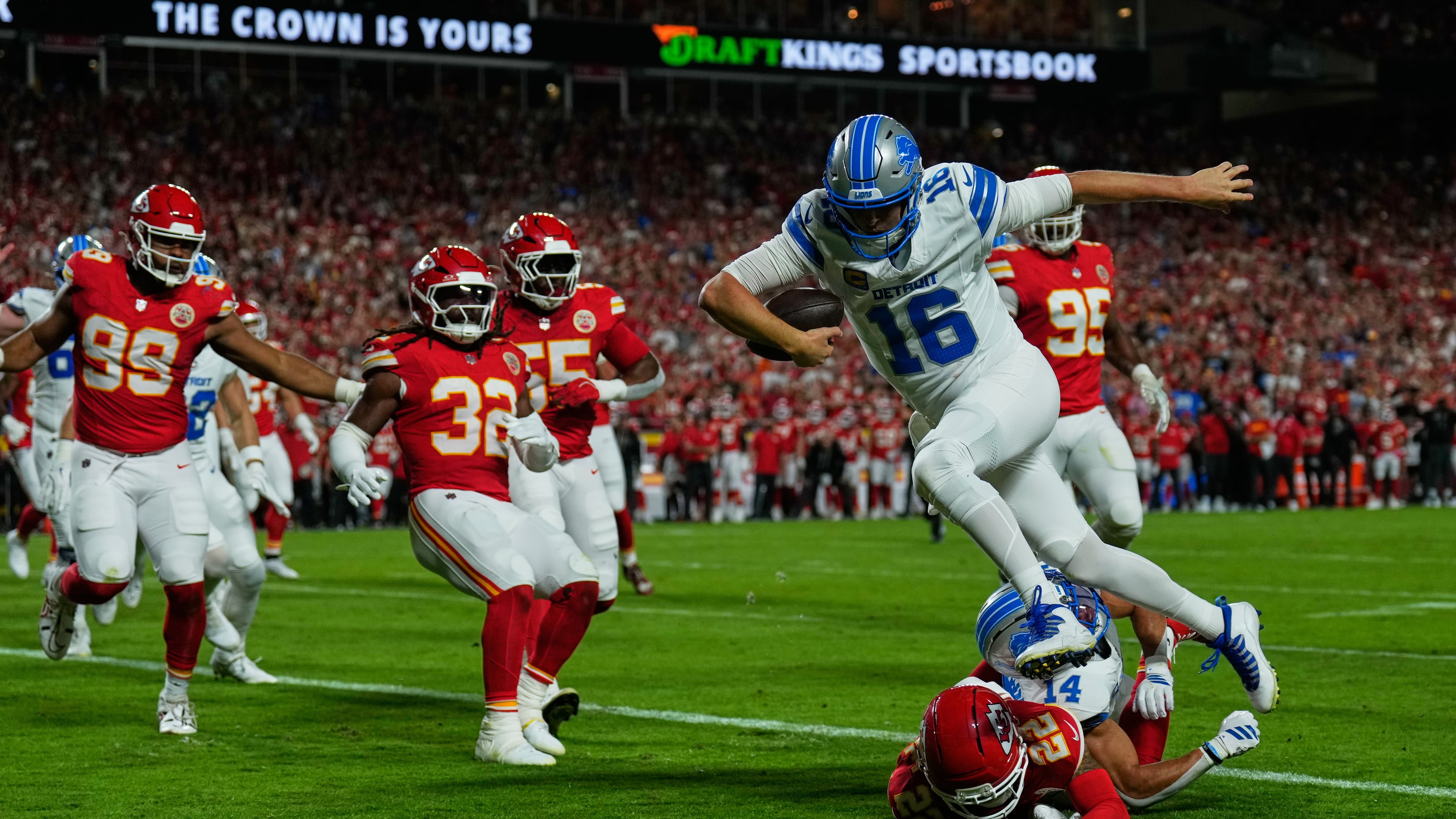 Detroit Lions quarterback Jared Goff (16) runs into the end zone over Kansas City Chiefs cornerback Trent McDuffie (22) on a play that was nullified after Goff was called for illegal motioin on the play during the first half of an NFL football game Sunday, Oct. 12, 2025, in Kansas City, Mo. (AP Photo/Charlie Riedel)