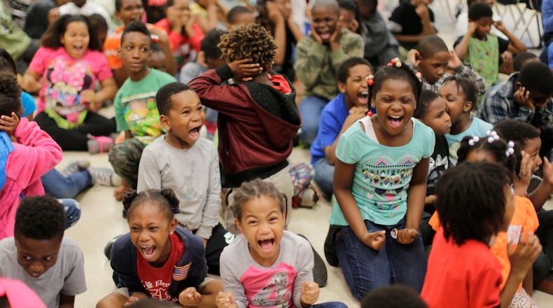 April 29,  2016 -  DeKalb County - Students scream as loud as they can so the rest of the school can hear them as the attendance parade gets underway.  Toney Elementary in DeKalb County  held their monthly Tiger Pride party to reward students for good behavior and also held a parade for students with perfect attendance.  BOB ANDRES  / BANDRES@AJC.COM
