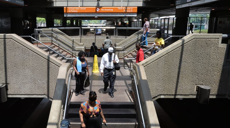 MARTA customers walk down to train platform at the College Park sation on Aug. 9, 2014.