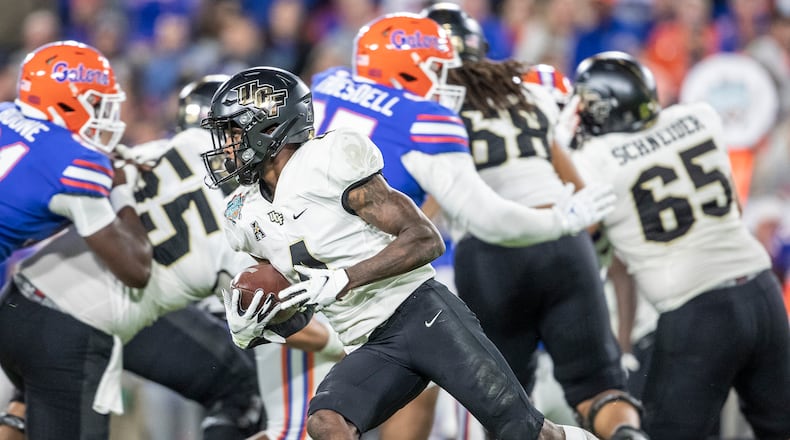 UCF Knights wide receiver Ryan O'Keefe (4) runs the ball upfield during the Gasparilla Bowl against the Florida Gators at Raymond James Stadium in Tampa, Florida, Thursday, Dec. 23, 2021. (Willie J. Allen Jr./Orlando Sentinel/TNS)