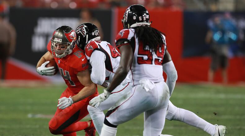 Tampa Bay Buccaneers tight end Cameron Brate (84) is chased donw by Atlanta Falcons linebacker Vic Beasley Jr. (44) and linebacker De’Vondre Campbell (59) during an NFL football game Thursday, Nov. 3, 2016, in Tampa, Fla. (Jeff Haynes/AP Images for Panini)