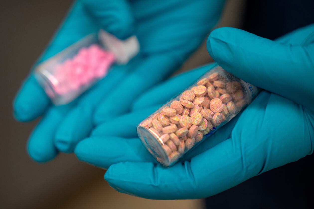 A forensic chemist with the Drug Enforcement Administration holds vials of fentanyl pills at a laboratory in northern Virginia. Almost everyone has a friend, classmate, family member or acquaintance who has overdosed from drugs that contained fentanyl, guest columnist Will Keyes writes. (Mark Schiefelbein/AP 2025)