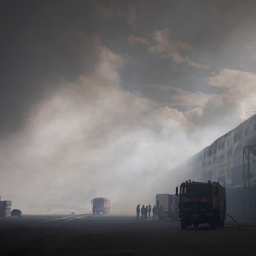 Smoke rises above warehouse stores after a Russian air attack in Kyiv, Ukraine, Thursday, Aug. 27, 2026. (AP Photo/Efrem Lukatsky)
