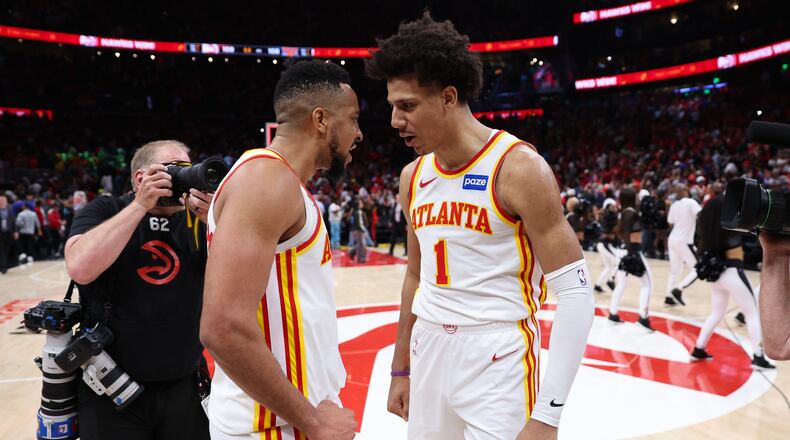Atlanta Hawks guard CJ McCollum, left, and forward Jalen Johnson, right, react after Game 3 of a first-round NBA playoffs basketball series against the New York Knicks, Thursday, April 23, 2026, in Atlanta. (AP Photo/Colin Hubbard)