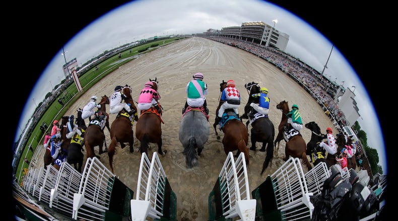 In this May 4, 2019, file photo, taken with a fisheye lens, the field breaks from the starting gate during the 145th running of the Kentucky Derby horse race at Churchill Downs in Louisville, Ky.
