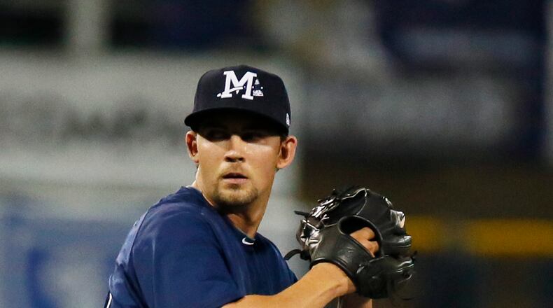 Atlanta Braves left-hander Mike Minor readies to pitch against a Mobile BayBears batter Thursday, April 3, 2014, at a Double-A Southern League baseball game at a rehab start for the Mississippi Braves in Pearl, Miss. Minor opened the season on the disabled list because of shoulder tendinitis, but the Braves hope he will be back in the big leagues quickly to help an ailing rotation. (AP Photo/Rogelio V. Solis)
