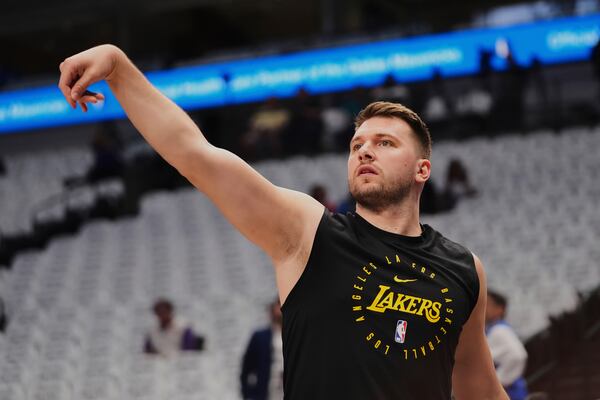 Los Angeles Lakers' Luka Doncic warms up before an NBA basketball game against the Dallas Mavericks in Dallas, Wednesday, April 9, 2025. (AP Photo/LM Otero)