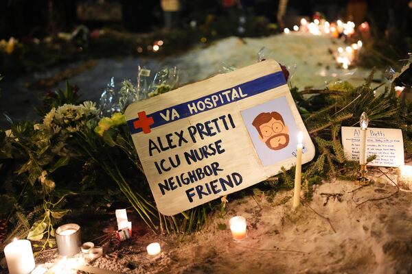 A sign for 37-year-old Alex Pretti, who was fatally shot by a U.S. Border Patrol officer on Saturday in Minneapolis. (Adam Gray/AP)