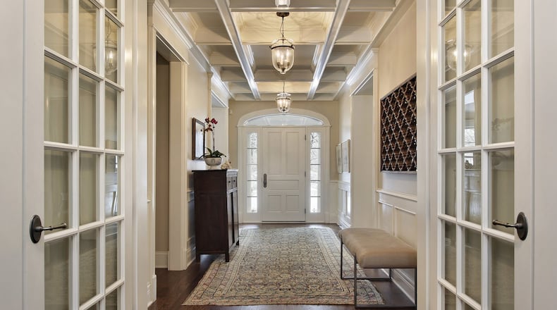 Upgrade your welcome mat with an antique rug that sets a classic, worldly tone. (Dreamstime)