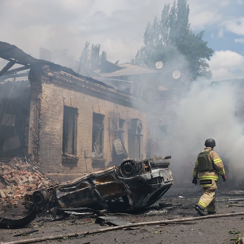 Rescue workers put out a fire at a building destroyed after a Russian strike on Zaporizhzhia, Ukraine, on Friday, June 26, 2026. (AP Photo/Evgeniy Maloletka)