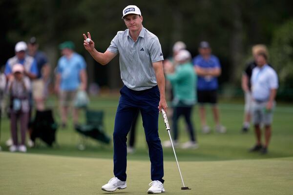 Matt McCarty waves after making a putt on the 17th hole during the second round at the Masters golf tournament, Friday, April 11, 2025, in Augusta, Ga. (AP Photo/George Walker IV)