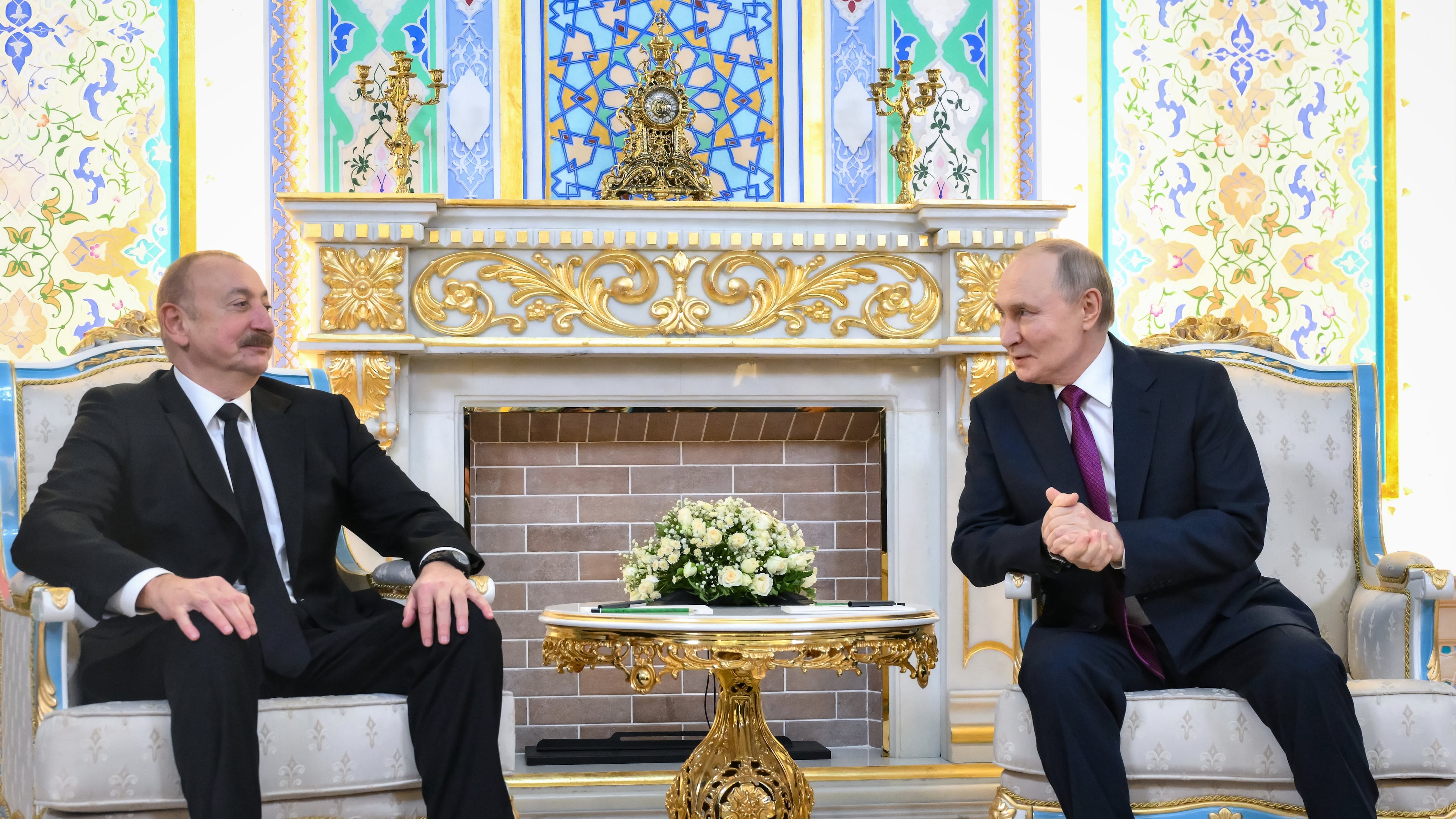 Russian President Vladimir Putin, right, and Azerbaijan's President Ilham Aliyev talk during their meeting on the sidelines of the Russia-Central Asia summit in Dushanbe, Tajikistan, on Thursday, Oct. 9, 2025. (Grigory Sysoyev, Sputnik, Kremlin Pool Photo via AP)