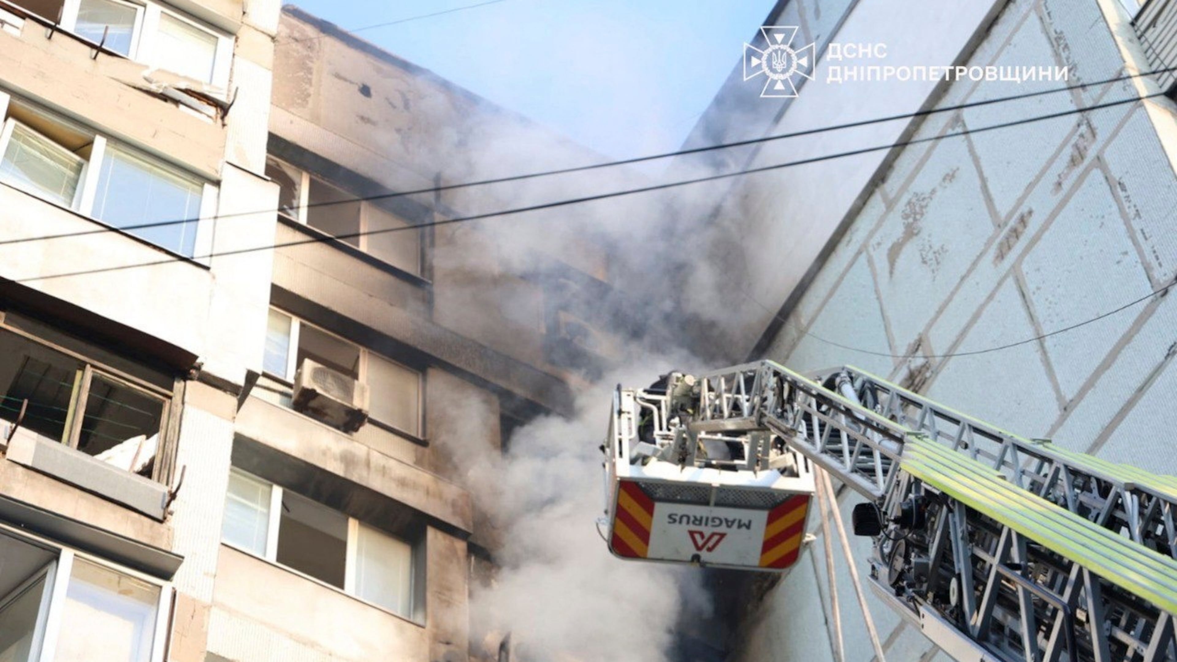 In this photo provided by the Ukrainian Emergency Services on Saturday, Sept. 20, 2025, a rescue worker puts out a fire of a residential house damaged by a Russian strike on Dnipro, Ukraine. (Ukrainian Emergency Service via AP)