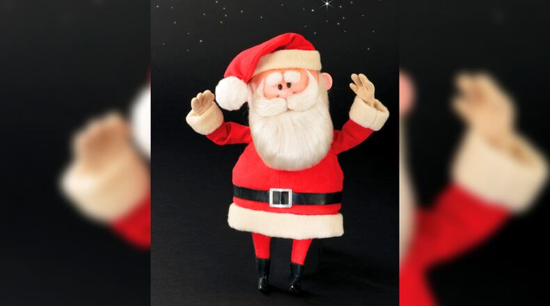 This image released by Profiles in History shows a Santa Claus puppet used in the filming of the 1964 Christmas special "Rudolph the Red-Nosed Reindeer." A buyer shouted out with glee that they would pay $368,000 for the Rudolph and Santa Claus figures used in the special. (Profiles in History via AP)
