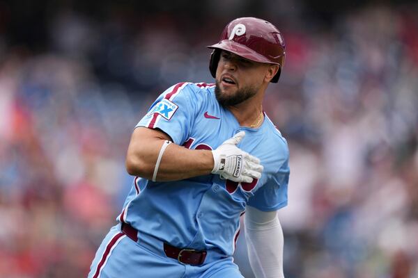 Philadelphia Phillies' Rafael Marchán reacts after hitting a two-run home run against Atlanta Braves pitcher AJ Smith-Shawver during the third inning in the first baseball game of a doubleheader Thursday, May 29, 2025, in Philadelphia. (AP Photo/Matt Slocum)