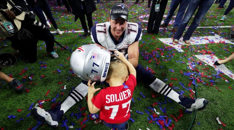 Nate Solder celebrated with his son Hudson after defeating the Atlanta Falcons 34-28 in overtime during Super Bowl LI in Houston.