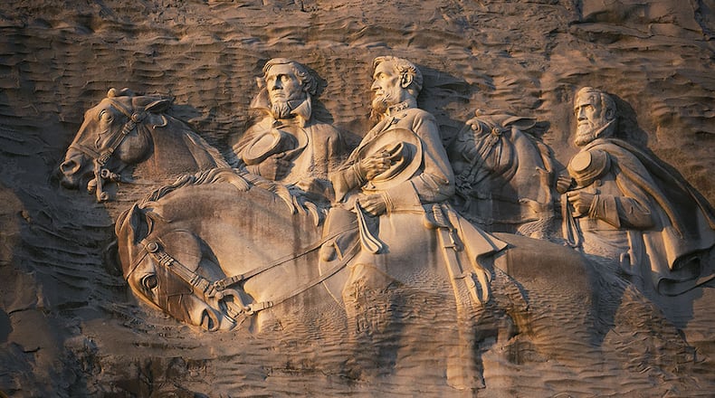 STONE MOUNTAIN CARVING (Stone Mountain Park): Let's start with the largest Confederate monument in the world. The 90-feet-by-190-feet carving of Robert E. Lee, Thomas "Stonewall" Jackson, and Jefferson Davis is also the largest bas-relief sculpture in the world. The carving was first conceived by a founding member of the United Daughters of the Confederacy in 1916. Work began in 1923, was scrapped and restarted in 1925, abandoned in 1928, restarted in 1964 and completed in 1972. (Phil Skinner / AJC file)