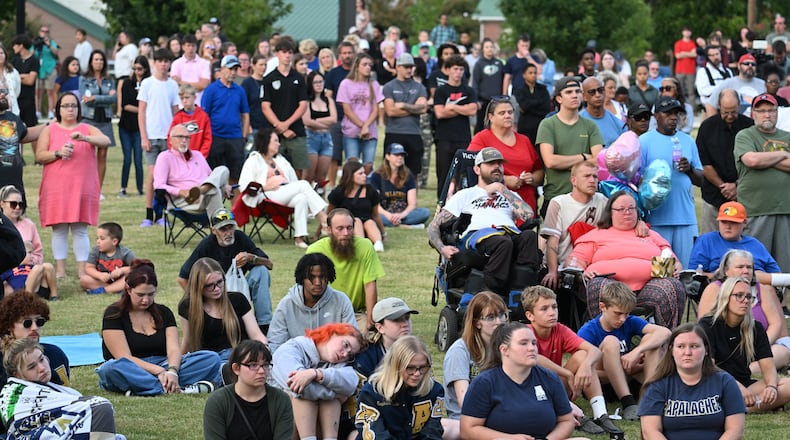 A community candlelight vigil on Sept. 4 at Jug Tavern Park in Winder, Georgia, in memory of four people who were killed in a school shooting at Apalachee High School that day, (Hyosub Shin/The Atlanta Journal-Constitution)