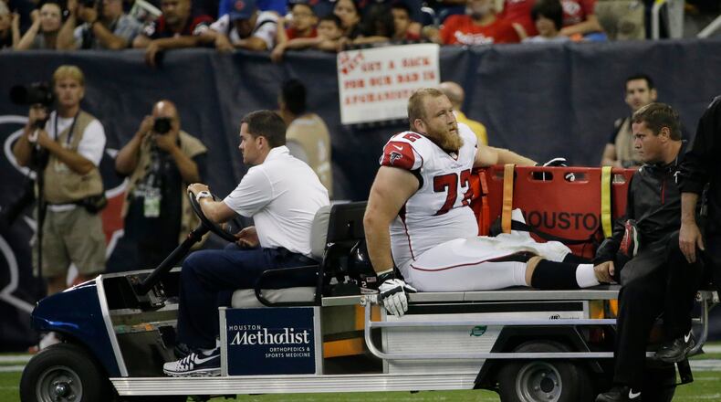 Atlanta Falcons' Sam Baker (72) leaves on a cart after he was injured during the second quarter of an NFL preseason football game against the Houston Texans, Saturday, Aug. 16, 2014, in Houston. (AP Photo/David J. Phillip)