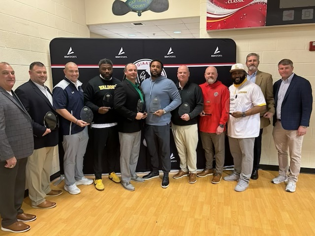GHSF Daily/AJC Varsity honored nine winners of the Improvement Tracker Award in Macon on Tuesday. From left are Keith Maloof with sponsor Formetco, Randy Crutchfield of Haralson County, Shelton Felton of Valdosta, Chuck Holland of Franklin County, Cap Burnett of North Clayton, Ron Duncan of Screven County, Korey Mobbs of Jackson County, Kevin Barnes of Lithonia, Tommy Lewis of Landmark Christian and Matt Leech with sponsor Formetco. (AJC)