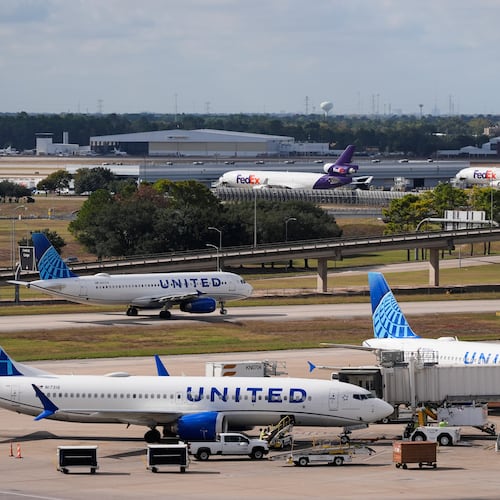 United Airlines and FedEx prepare for departure at George Bush Intercontinental Airport on Friday, Nov. 7, 2025, in Houston. (AP Photo/Ashley Landis)